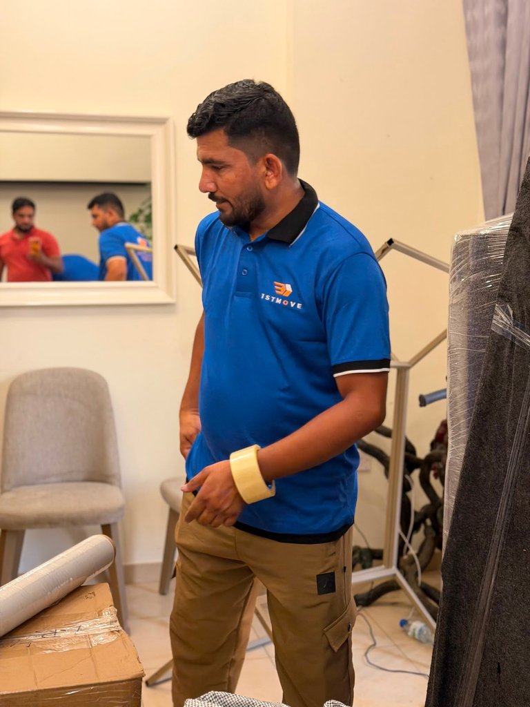 1stMove crew moving furniture out of a Dubai apartment tower