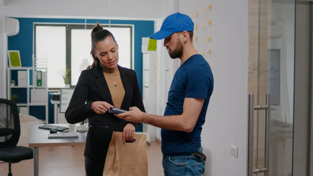 a lady instructing a mover about the move