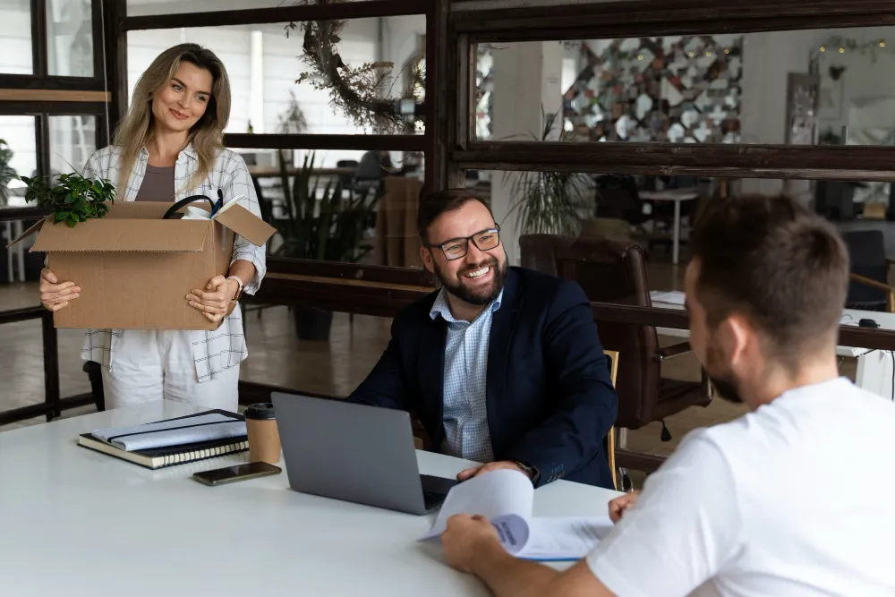 3 persons talking about law office moving